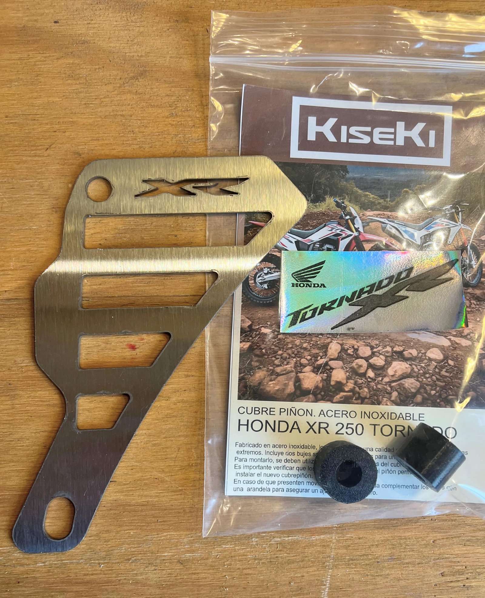 CUBRE PIÑON. ACERO INOXIDABLE  HONDA TORNADO 250